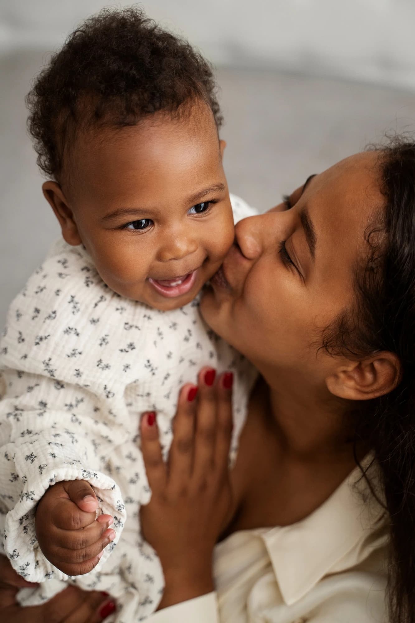 Smiling baby with mother